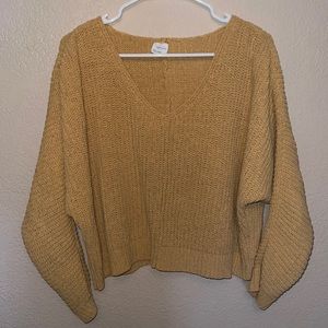 Cropped, thick yellow sweater.